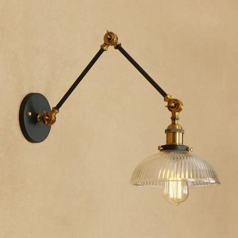 Adjustable brass and black decorbites glass arm wall lamp with ribbed glass shade in rustic vintage style