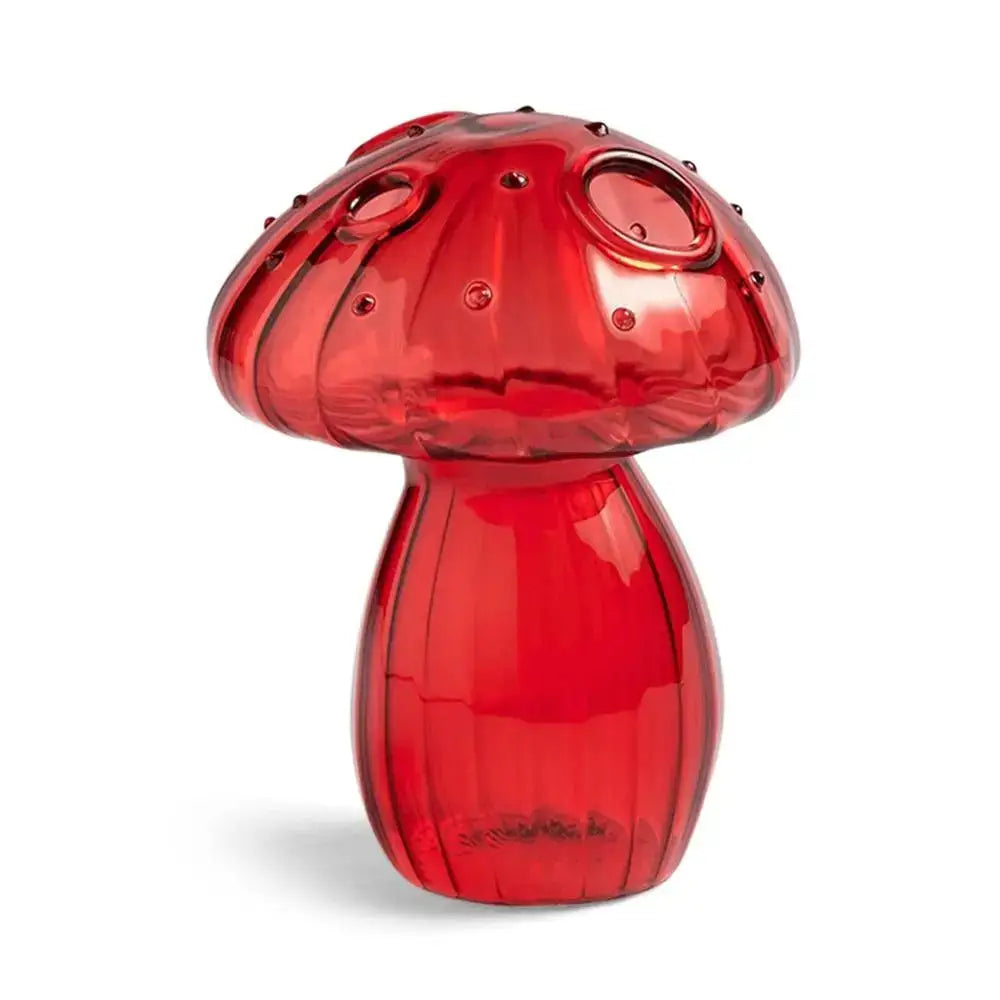 Vibrant red glass mushroom-shaped pepper mill with textured ridges and circular cutouts in decorbites™ glass aromatherapy vase for home decor