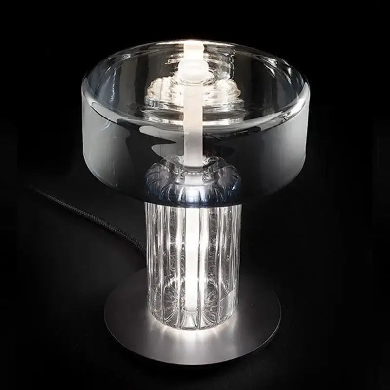 A sleek decorbites glass art desk lamp with clear ridged glass base and polished chrome top for bedroom and living room