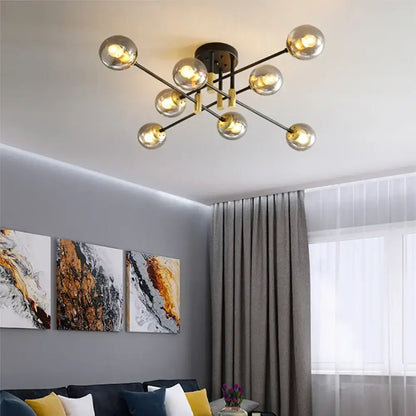 Modern decorbites glass ball black chandelier with gold accents and spherical glass bulbs for dining table lighting