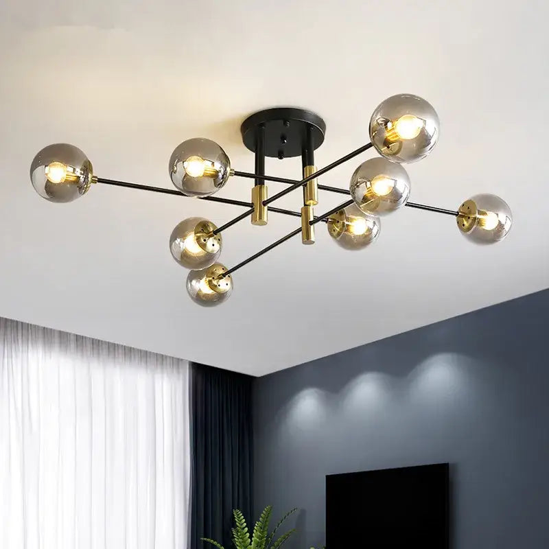 Modern decorbites glass ball black chandelier with gold accents and spherical glass globes for nordic dining rooms