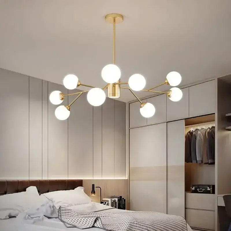 Gold-toned DecorBites glass ball ceiling chandelier with frosted glass bulbs in a branching design for indoor lighting