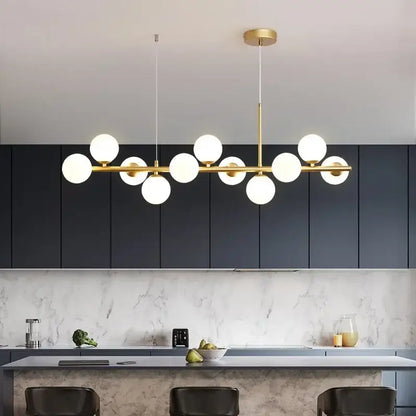 Gold-toned modern pendant DecorBites™ ball ceiling chandelier with multiple spherical glass ball bulbs for dining room