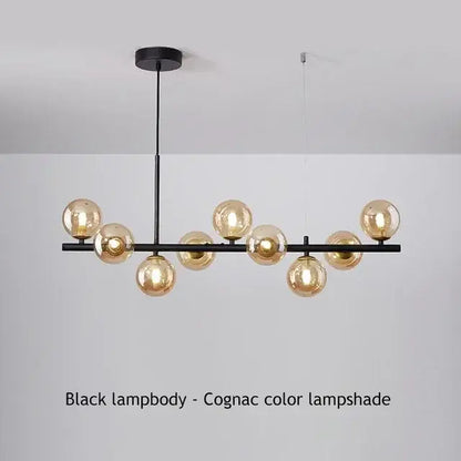 Black metal DecorBites™ ball ceiling chandelier with multiple amber-tinted glass globe shades for home lighting