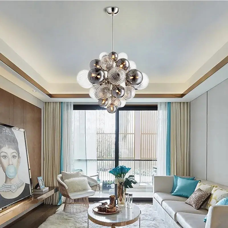 Modern ceiling chandelier featuring decorbites glass ball orbs in metallic and frosted glass with polished chrome fixture