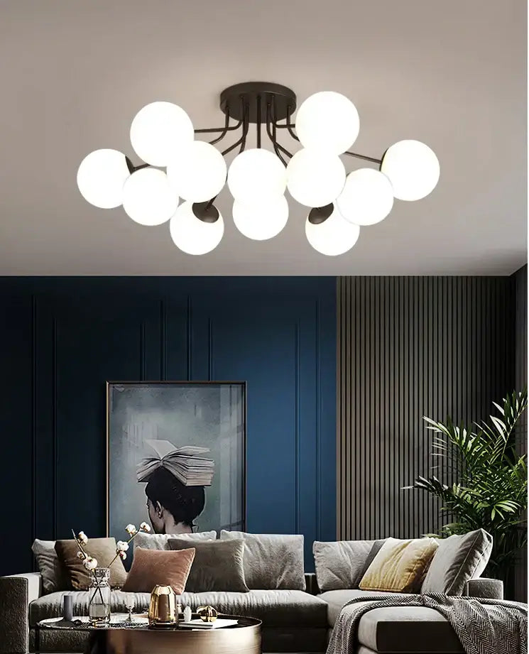 Modern ceiling light fixture featuring multiple white glass ball globes clustered around a dark metal base by DecorBites glass ball ceiling chandelier