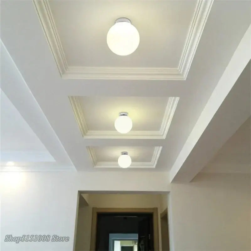 Three round frosted glass ceiling lights with metallic fixtures in a recessed tray ceiling decorbites glass ball ceiling light