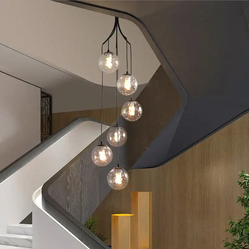 Modern five-bulb decorbites glass ball chandelier with clear glass spheres and black metal arms for living dining rooms