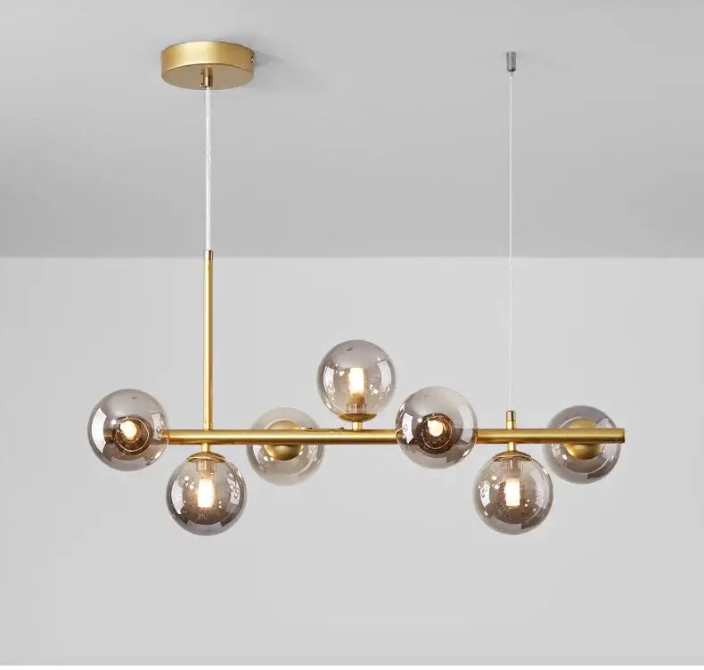 Gold-toned DecorBites™ glass ball chandelier with smoked glass spheres and a sleek horizontal bar design for home lighting