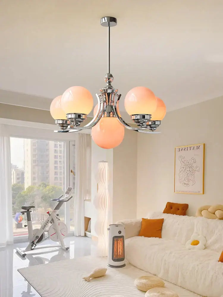 Decorbites glass ball chandelier with five warm-toned translucent glass globes and polished chrome frame for modern decor