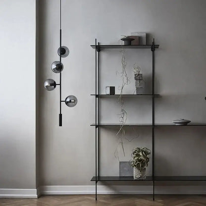 Black metal shelf with glass shelves and minimalist design paired with decorbites glass ball chandelier pendant light