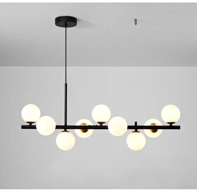 Black DecorBites™ glass ball chandelier with nine frosted glass globes on a modern lighting fixture bar