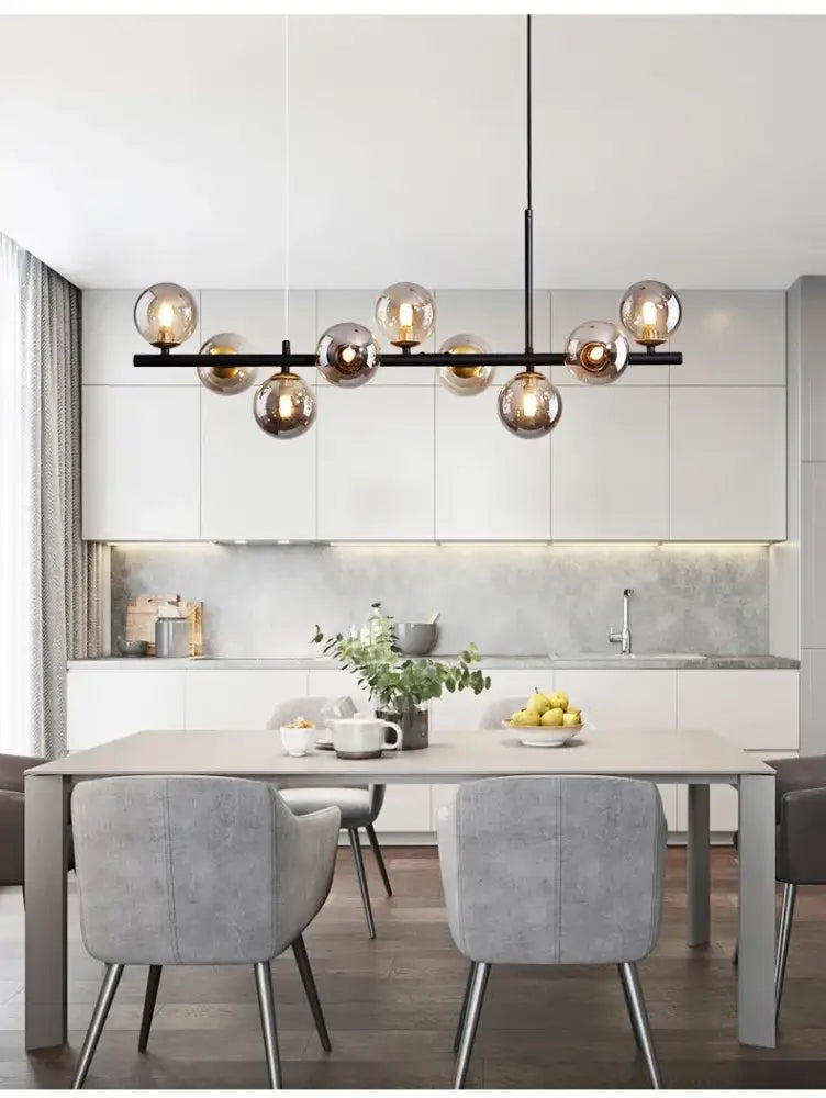 Modern black metal glass ball chandelier with multiple amber-tinted glass globe bulbs lighting fixture by DecorBites