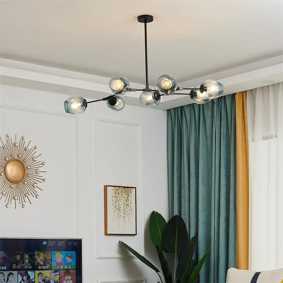 Modern black metal DecorBites™ glass ball LED chandelier with six clear glass globe bulbs in Nordic style design