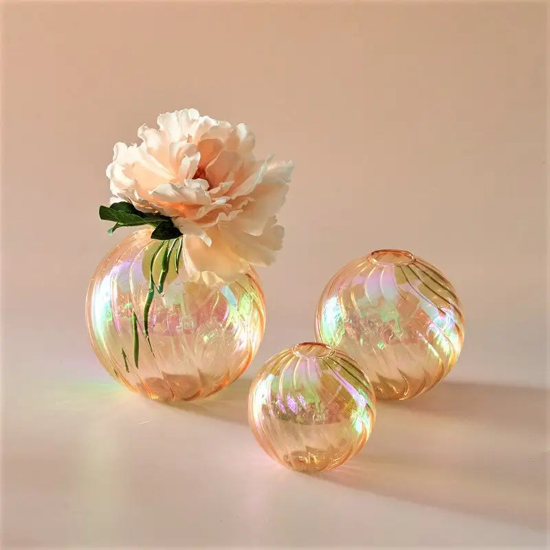 Iridescent peach DecorBites™ glass ball vase set with swirling patterns, one holding a cream peony for home decor