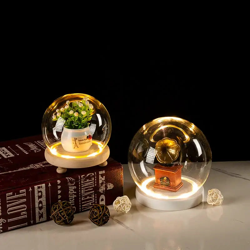 Decorbites™ glass bell jar terrarium with led light featuring illuminated glass dome with potted plant and gramophone model