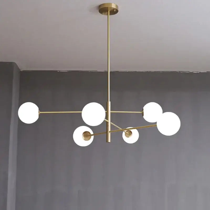 Modern brass chandelier with six frosted glass globes in a geometric pattern by decorbites glass brass for living rooms