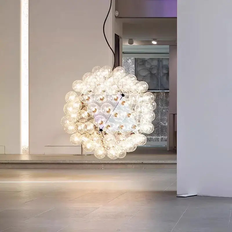 Decorbites glass bubble chandelier with clear glass bulbs illuminated in warm white for bubble kitchen island lighting