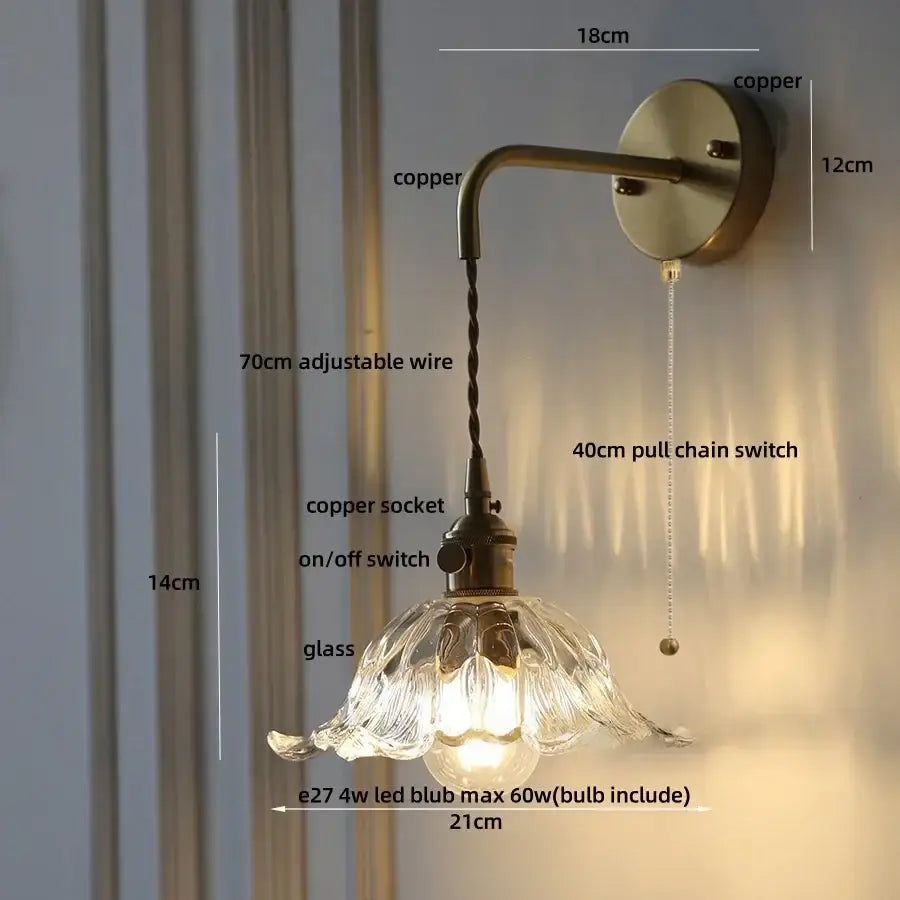 Antique brass-finished decorbites™ flower led wall sconce with copper green flower glass shade and adjustable arm