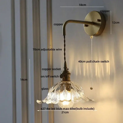 Antique brass-finished decorbites™ flower led wall sconce with copper green flower glass shade and adjustable arm