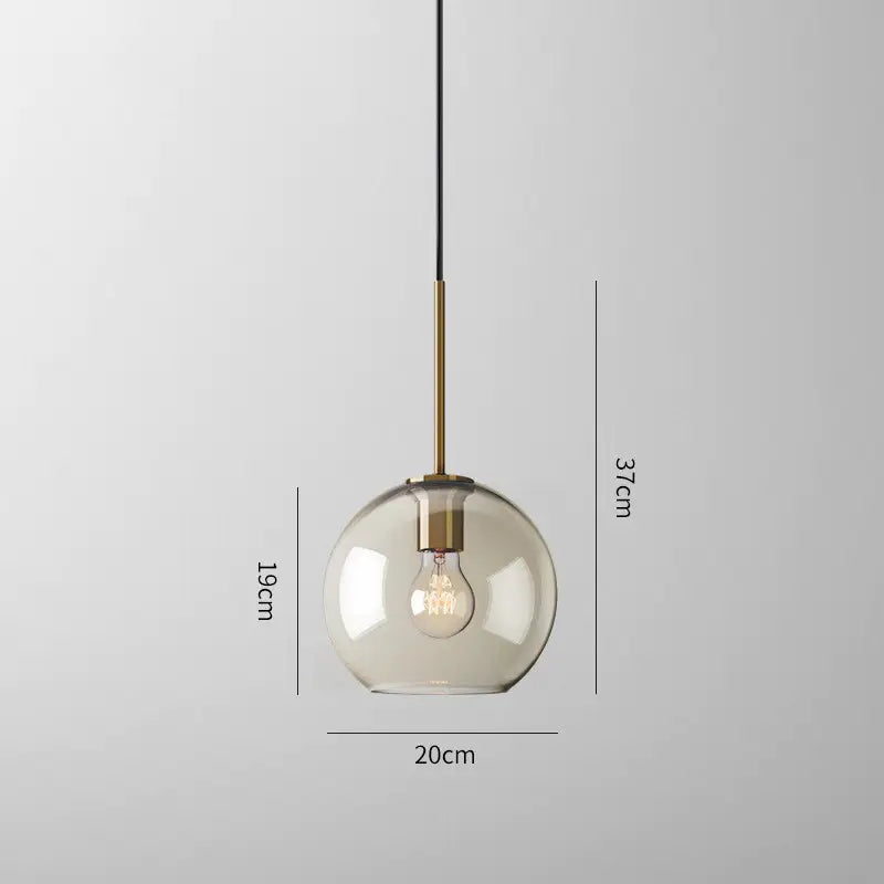 Decorbites™ glass pendant lights featuring a modern smoked glass globe and exposed filament bulb with brass rod suspension