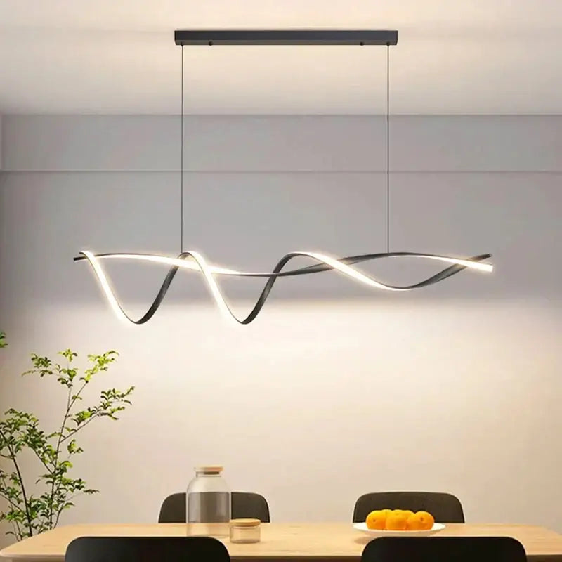 Modern black and white glass pendant lights with sleek wave-like LED design for contemporary home decor by DecorBites