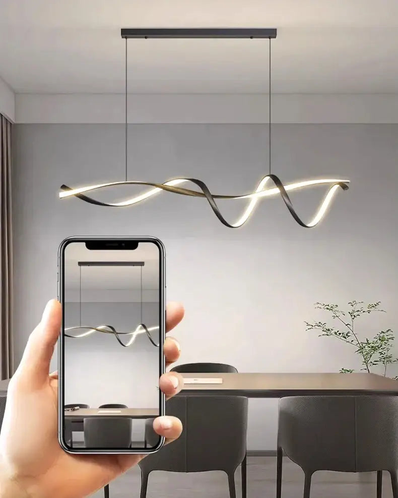 Modern black and gold twisted glass pendant light with sleek flowing design by decorbites pendant lights for home decor