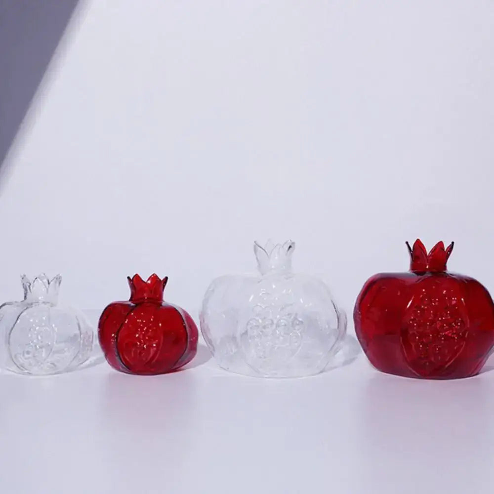 Red glass pomegranate glass vase with embossed seeds and crown top for elegant home decor by decorbites