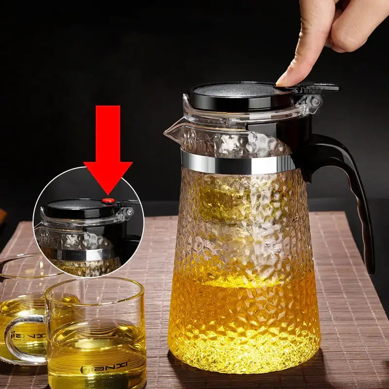 Clear glass tea maker decorbites glass tea with hammered surface and black lid with red button release for brewing tea