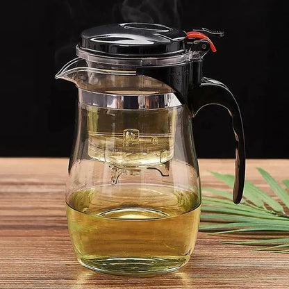 Clear glass tea pitcher with black lid and built-in filter for steeping leaves from decorbites glass tea set