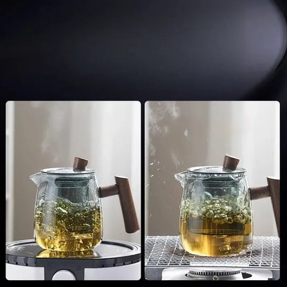 DecorBites™ glass tea set with solid wood handle and lid filled with steaming golden tea showcasing tea water separation technology