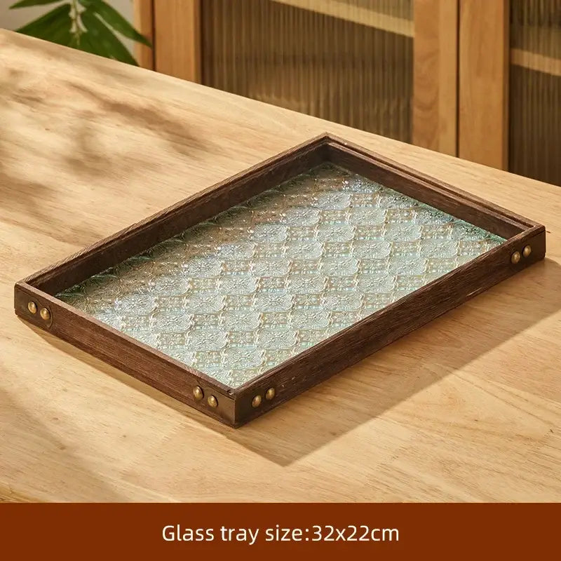 Rectangular retro glass tray with dark wood frame and brass rivets featuring intricate pattern in decorbites tea set