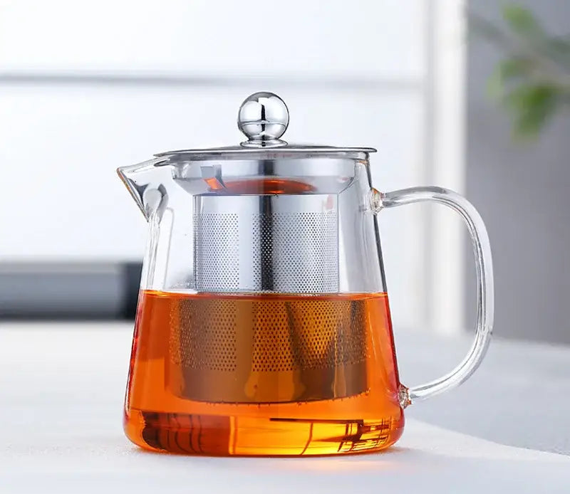 Clear decorbites glass teapot 550ml with silver infuser and lid knob filled with amber tea ideal for direct fire heating