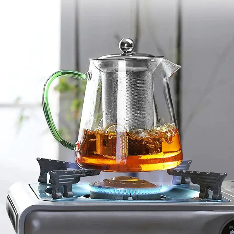 Clear glass DecorBites glass teapot 550ml with green handle silver lid and internal metal infuser strainer filter