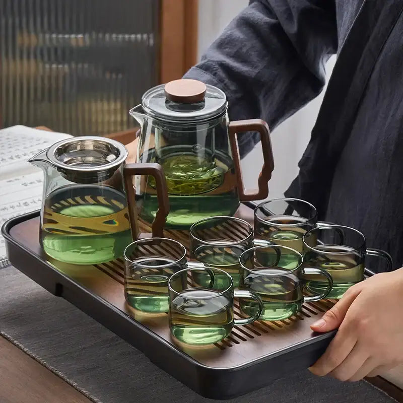 A decorbites glass teapot set with wooden handles and lids including a high temp kung fu teapot and six matching glass cups