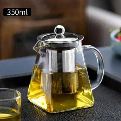 Clear glass teapot with stainless steel lid and built-in filter holding 350ml of golden tea from decorbites glass kungfu tea set