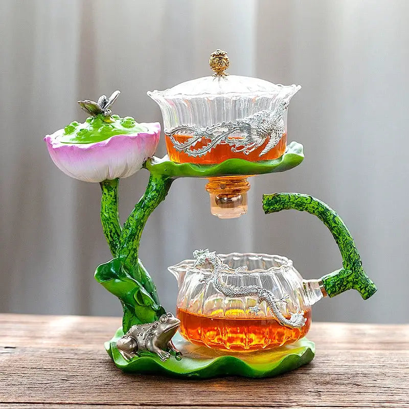 Decorbites glass teapot with two-tiered lazy tea infuser featuring silver dragon and lotus design on glass stand