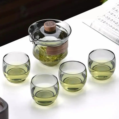 Clear glass teapot set with wooden lid and handle and four green-tinted cups decorbites glass teapot for kung fu tea