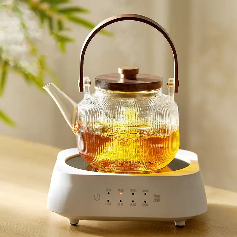 DecorBites glass teapot set with clear ribbed glass, wooden lid and handle on white electric heating base