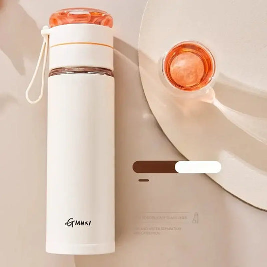 A sleek white stainless steel thermos cup with tea separation and an orange lid by gianxi for office use