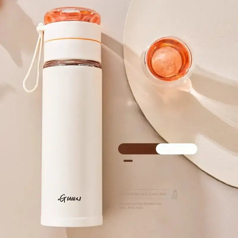 A sleek white stainless steel thermos cup with tea separation and an orange lid by gianxi for office use