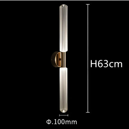 A modern DecorBites glass tubes pendant lamp with two vertical ridged glass tubes and polished brass metal bracket