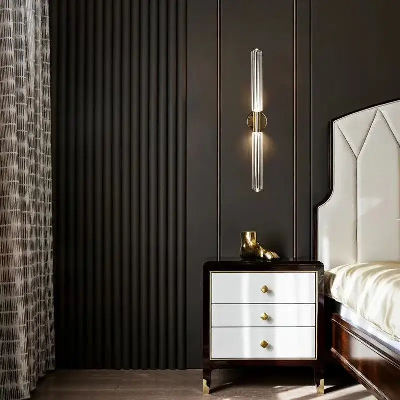 A sleek decorbites glass tubes pendant lamp with clear glass tube and gold-toned circular accents for modern lighting