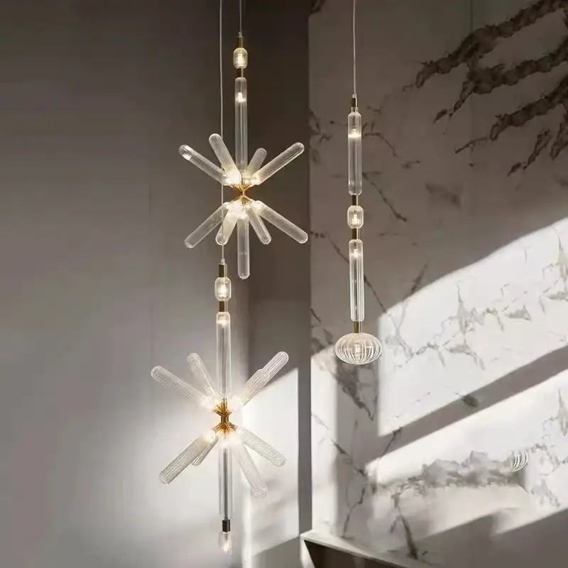 Modern decorbites glass tubes pendant lamp with gold-toned metal accents and clear faceted crystal arms for luxury lighting