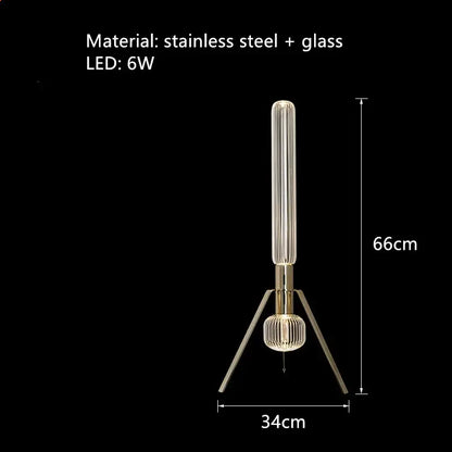 A modern floor lamp with slender ribbed glass tubes and gold-toned stainless steel base for elegant decorbites glass tubes led lighting