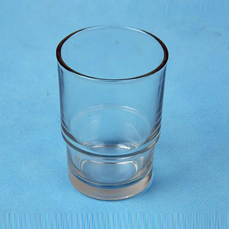 DecorBites glass tumbler cup in clear glass with thick rounded rim and ridges near base for bathroom cup holder use