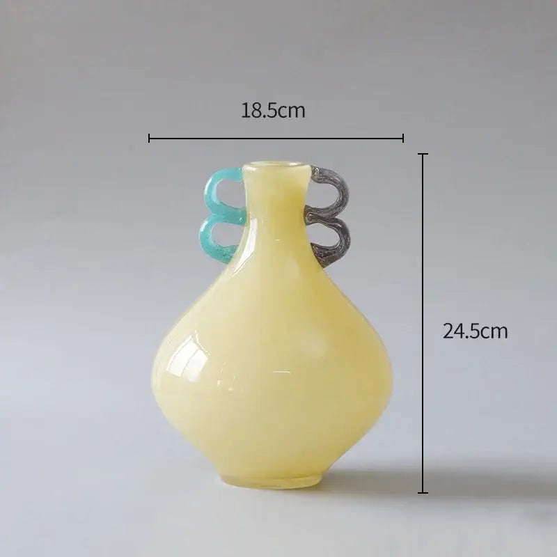 Translucent yellow glass vase with contrasting turquoise and dark gray handles from decorbites glass vase collection for modern decor