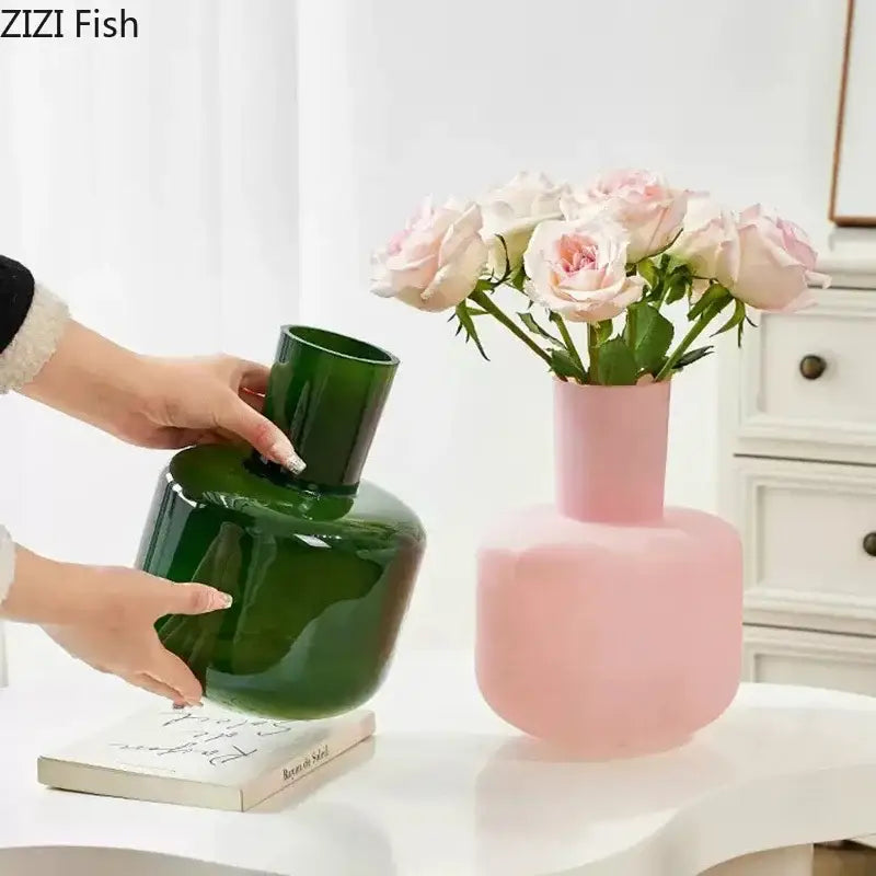 A matte pink decorbites glass vase with a rounded body and slender neck for glass vase desk decoration with artificial flowers