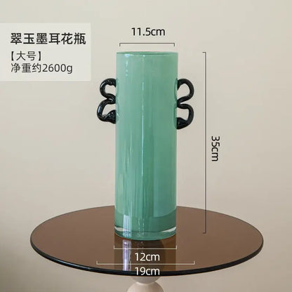 Decorbites glass vase in translucent mint green with black twisted handles for flower arrangement and home decoration
