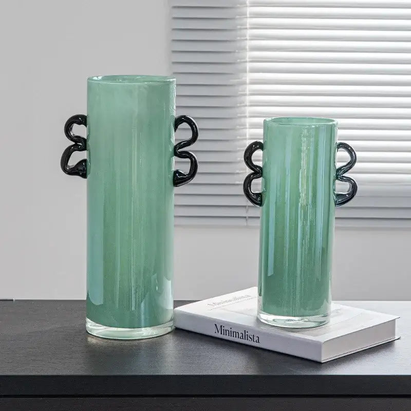 Two mint green decorbites glass vases with black twisted handles ideal for hydroponics and home decoration